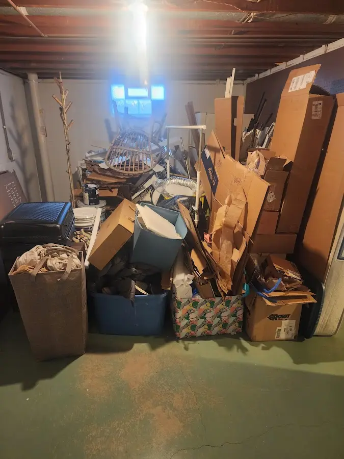 Roll-off dumpster container at job site for Roll Off Dumpster Rental in Clinton